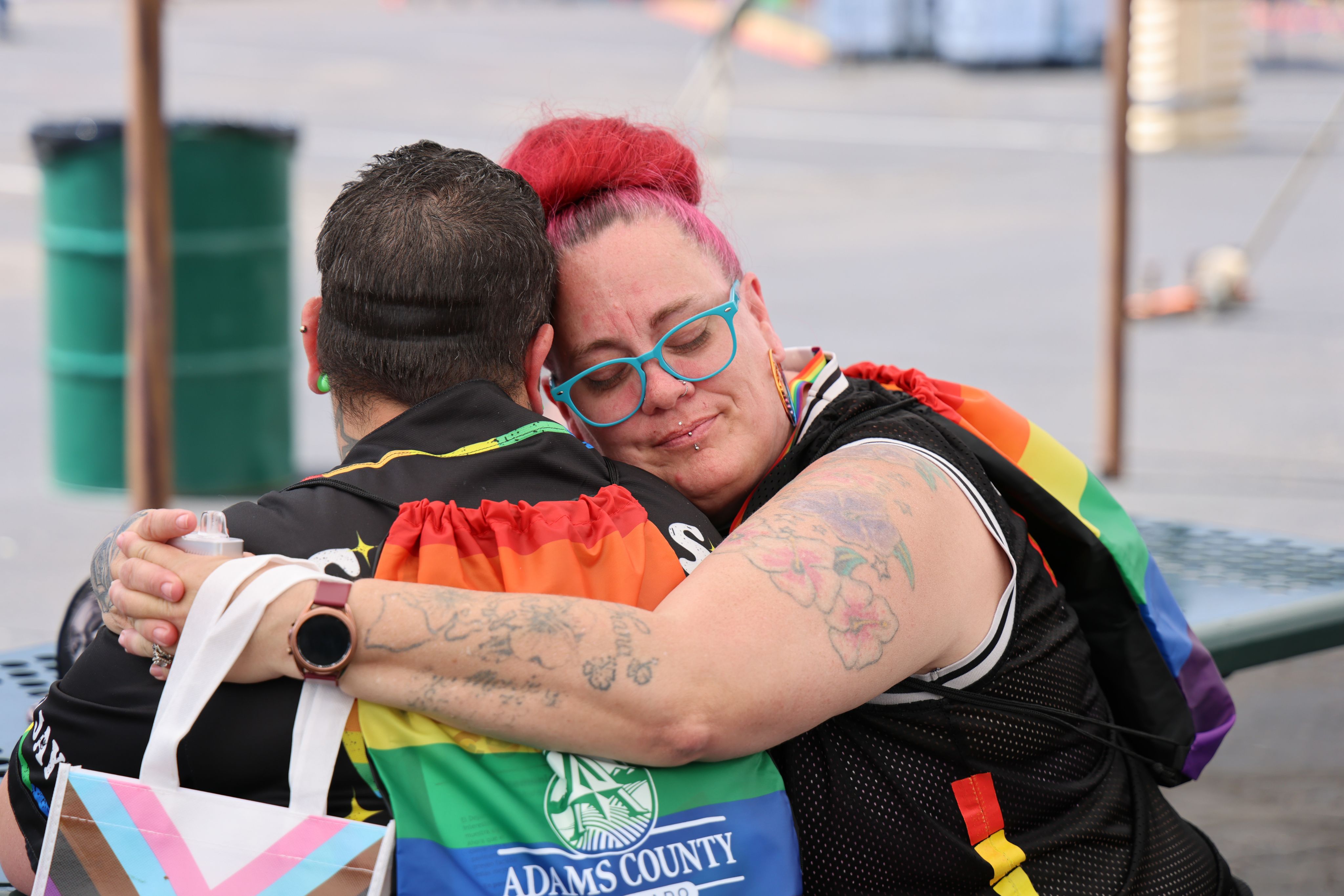 Two people hugging at Adams County Pride.