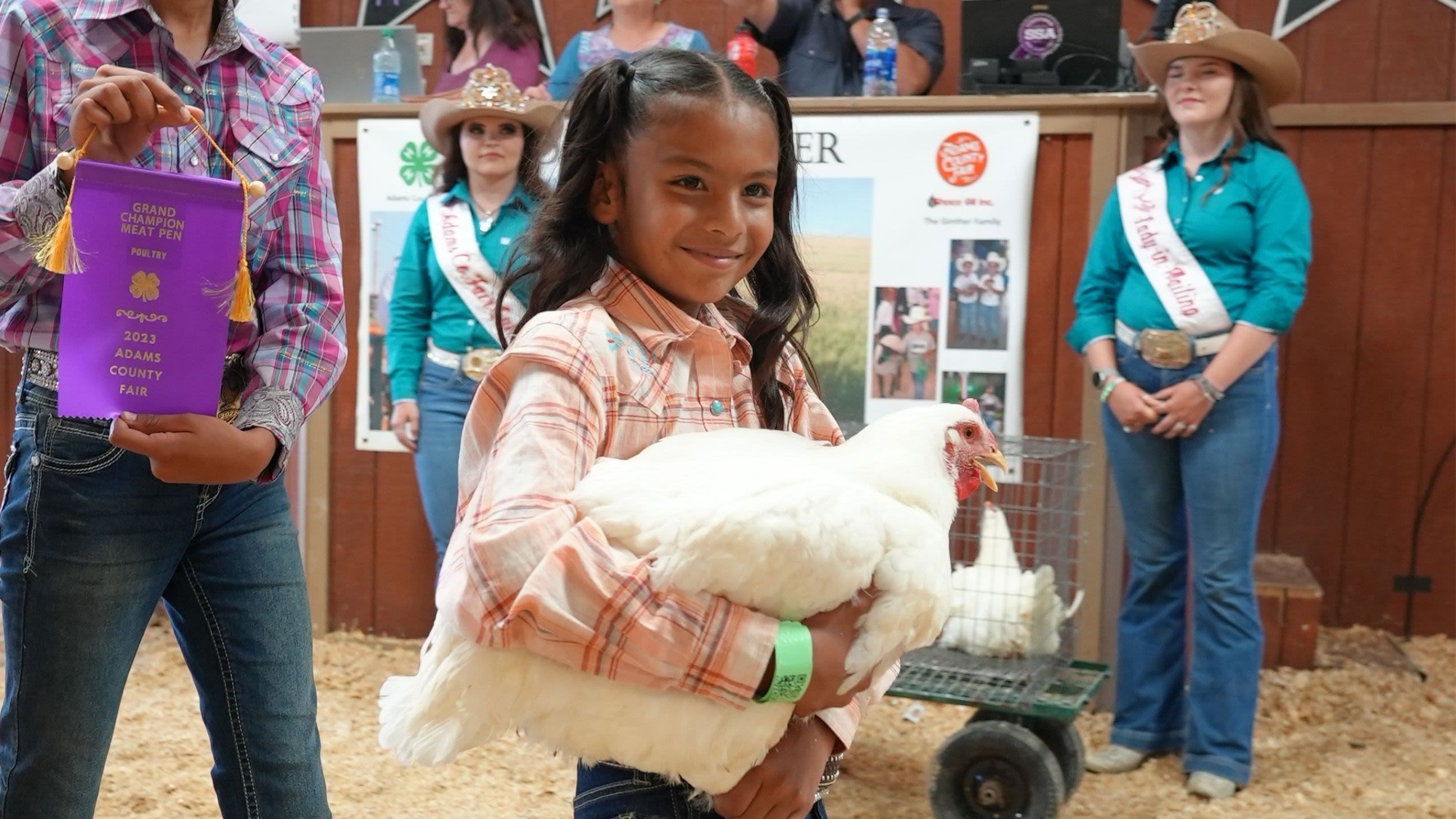 A little girl competing in the 4-H Poultry Show at the Adams County Fair.